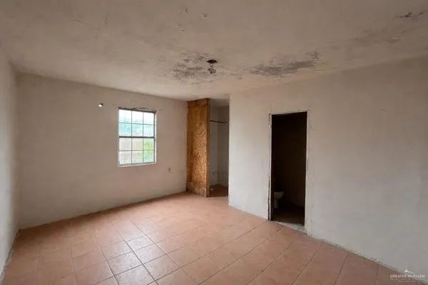 a view of an empty room with window
