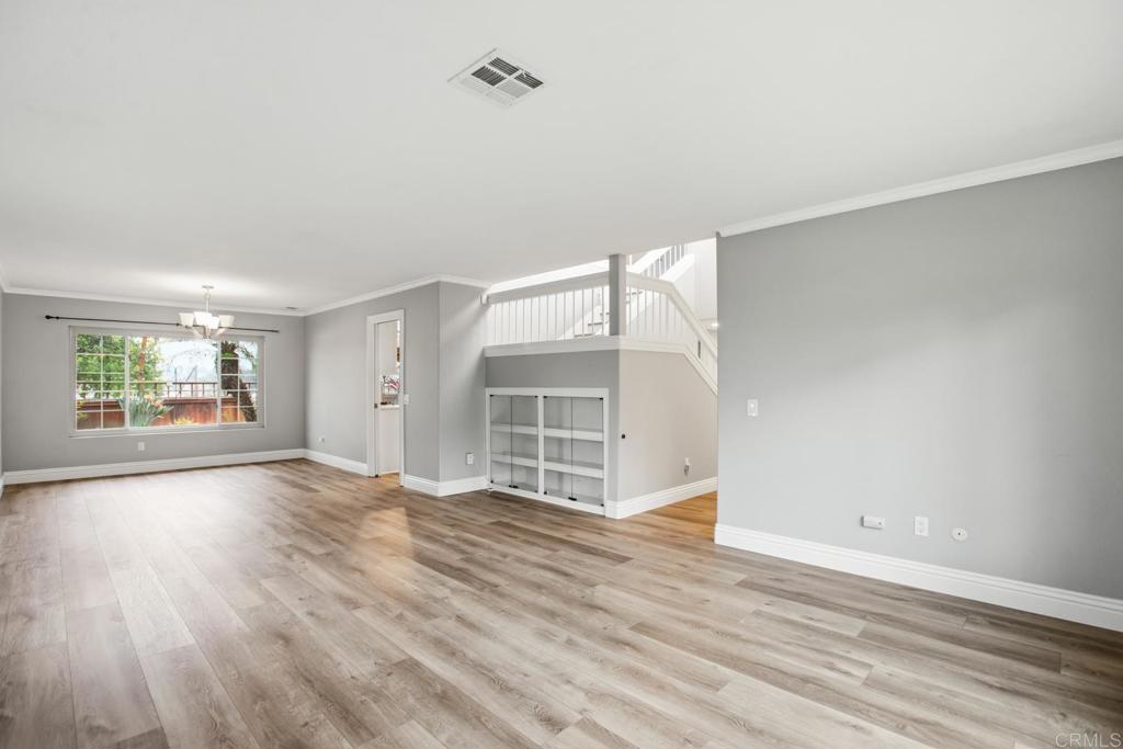 391 Via Almansa Encinitas, CA 92024 - Photo 14 of 35 an empty room with wooden floor and windows
