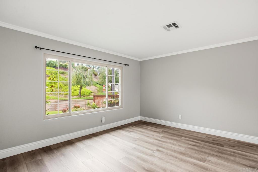 391 Via Almansa Encinitas, CA 92024 - Photo 15 of 35 a view of an empty room with wooden floor and a window