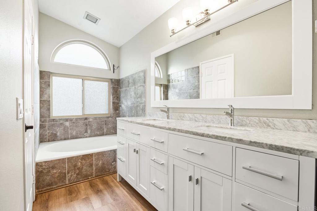 391 Via Almansa Encinitas, CA 92024 - Photo 20 of 35 a bathroom with a tub sink and mirror