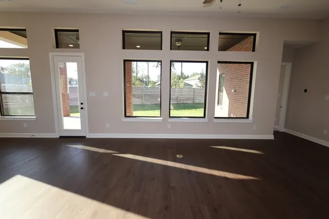 a kitchen with kitchen island granite countertop a sink a counter top space appliances and cabinets