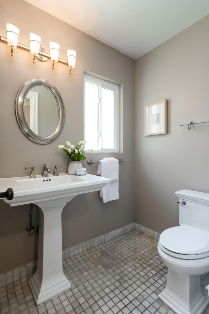 356 Barbara Way Hillsborough, CA 94010 - Photo 11 of 37 a bathroom with a toilet sink and mirror