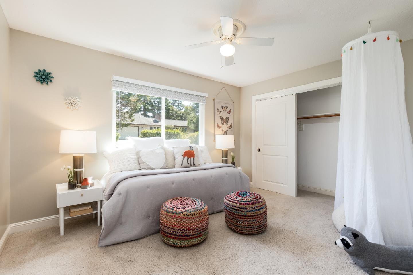 356 Barbara Way Hillsborough, CA 94010 - Photo 12 of 37 a bedroom with a bed and a chandelier