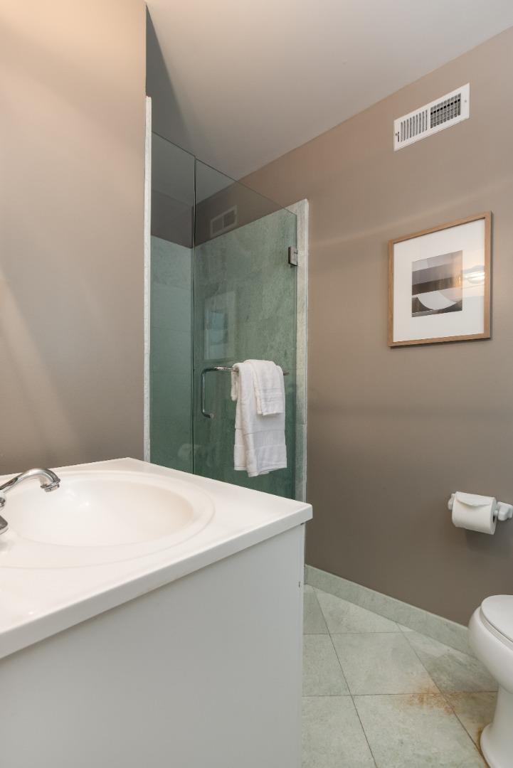 356 Barbara Way Hillsborough, CA 94010 - Photo 15 of 37 a bathroom with a sink a toilet and mirror