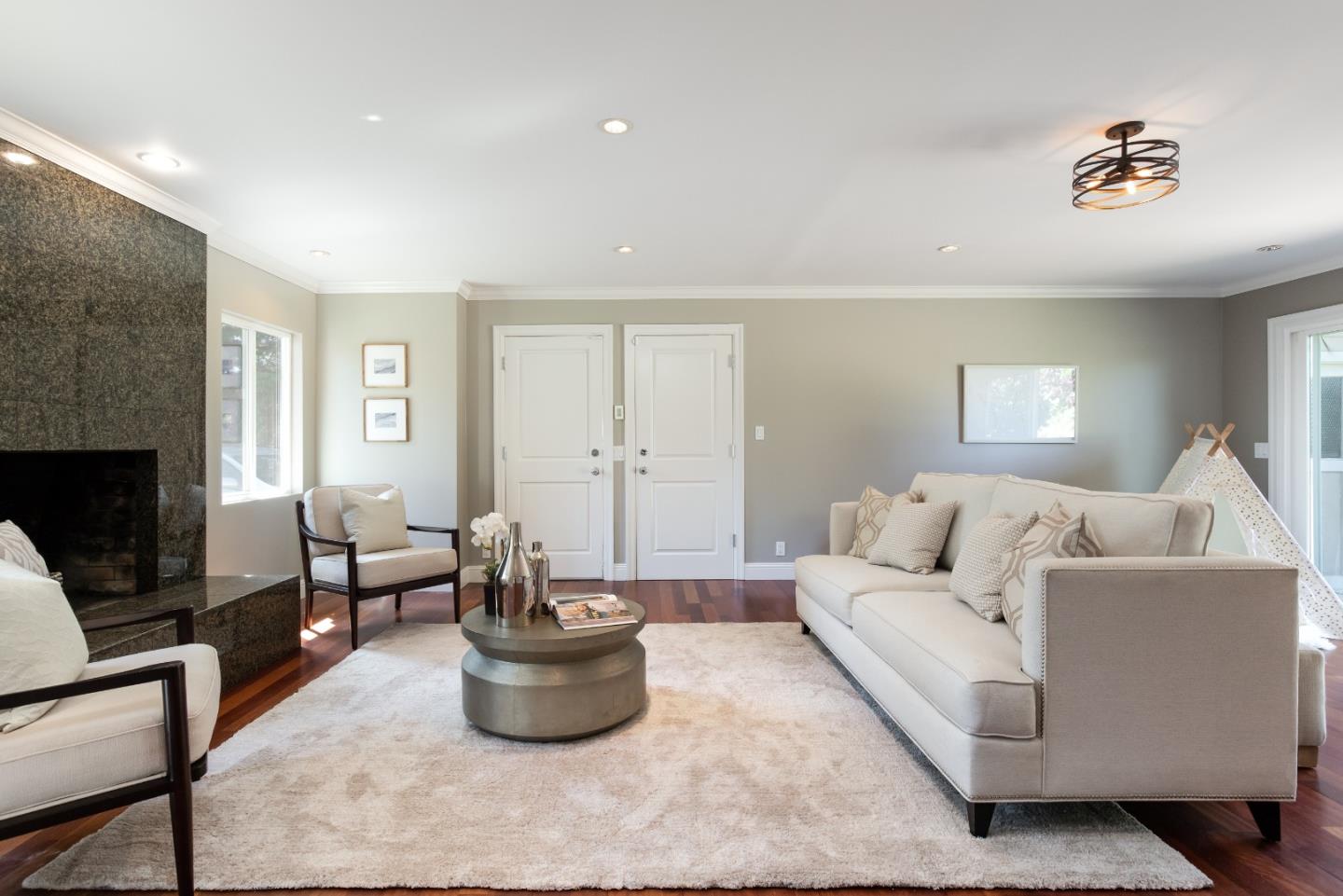 356 Barbara Way Hillsborough, CA 94010 - Photo 19 of 37 a living room with furniture and a fireplace