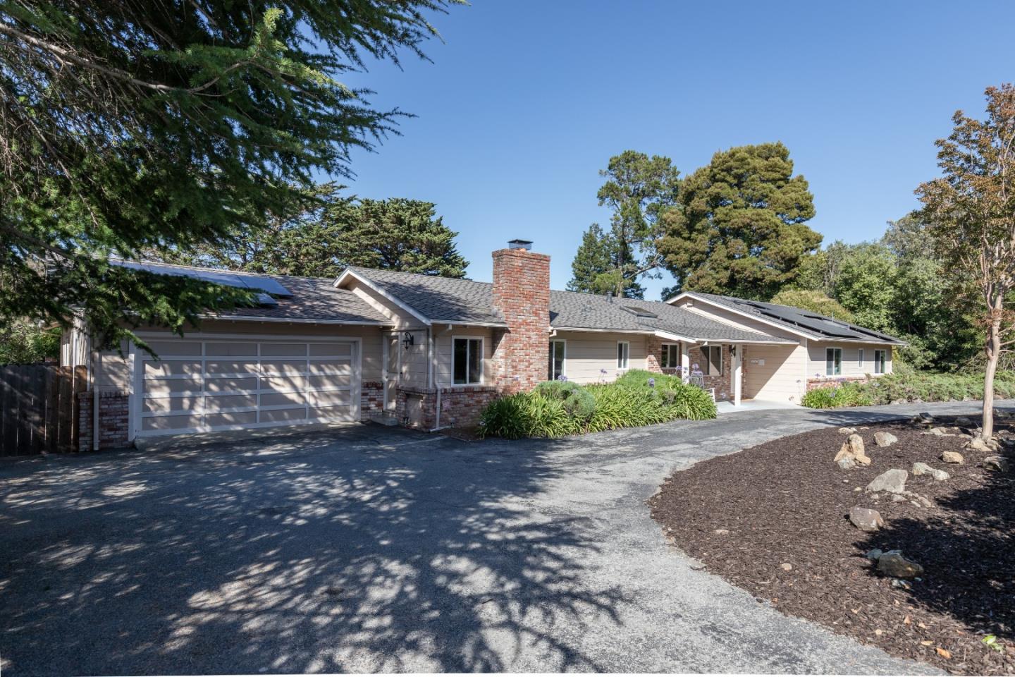 356 Barbara Way Hillsborough, CA 94010 - Photo 2 of 37 a front view of a house with a garden