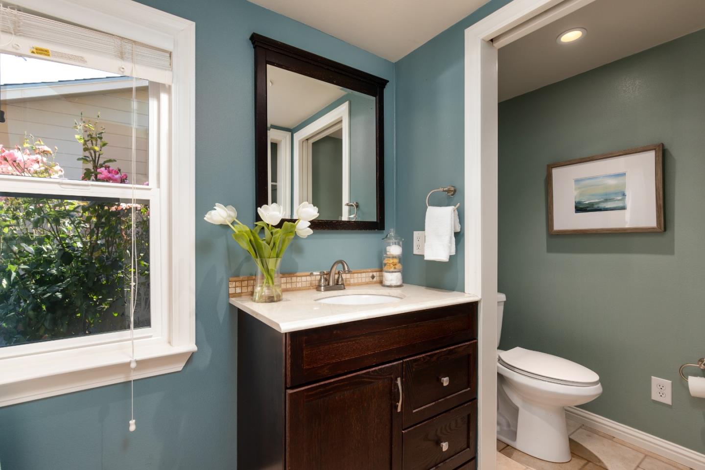 356 Barbara Way Hillsborough, CA 94010 - Photo 27 of 37 a bathroom with a sink vanity mirror and toilet