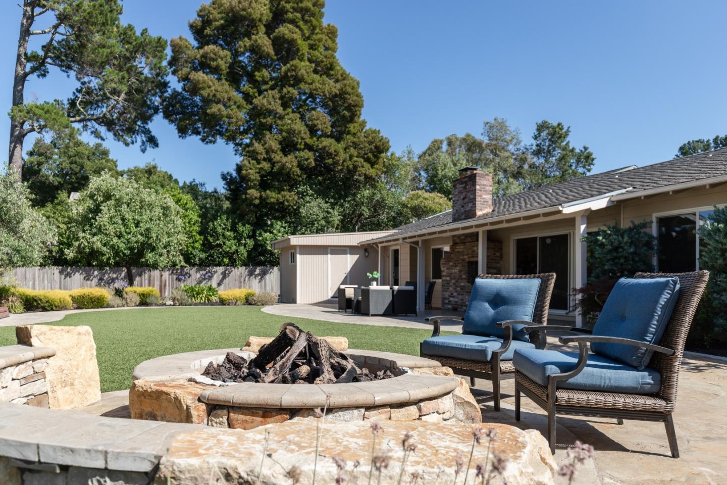 356 Barbara Way Hillsborough, CA 94010 - Photo 30 of 37 a view of a patio with couches table and chairs and garden