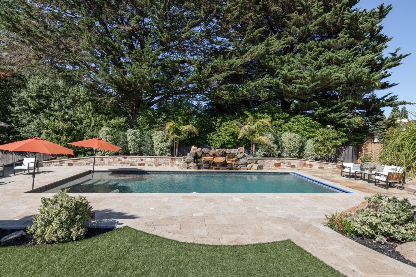 356 Barbara Way Hillsborough, CA 94010 - Photo 31 of 37 a view of swimming pool with lawn chairs under an umbrella