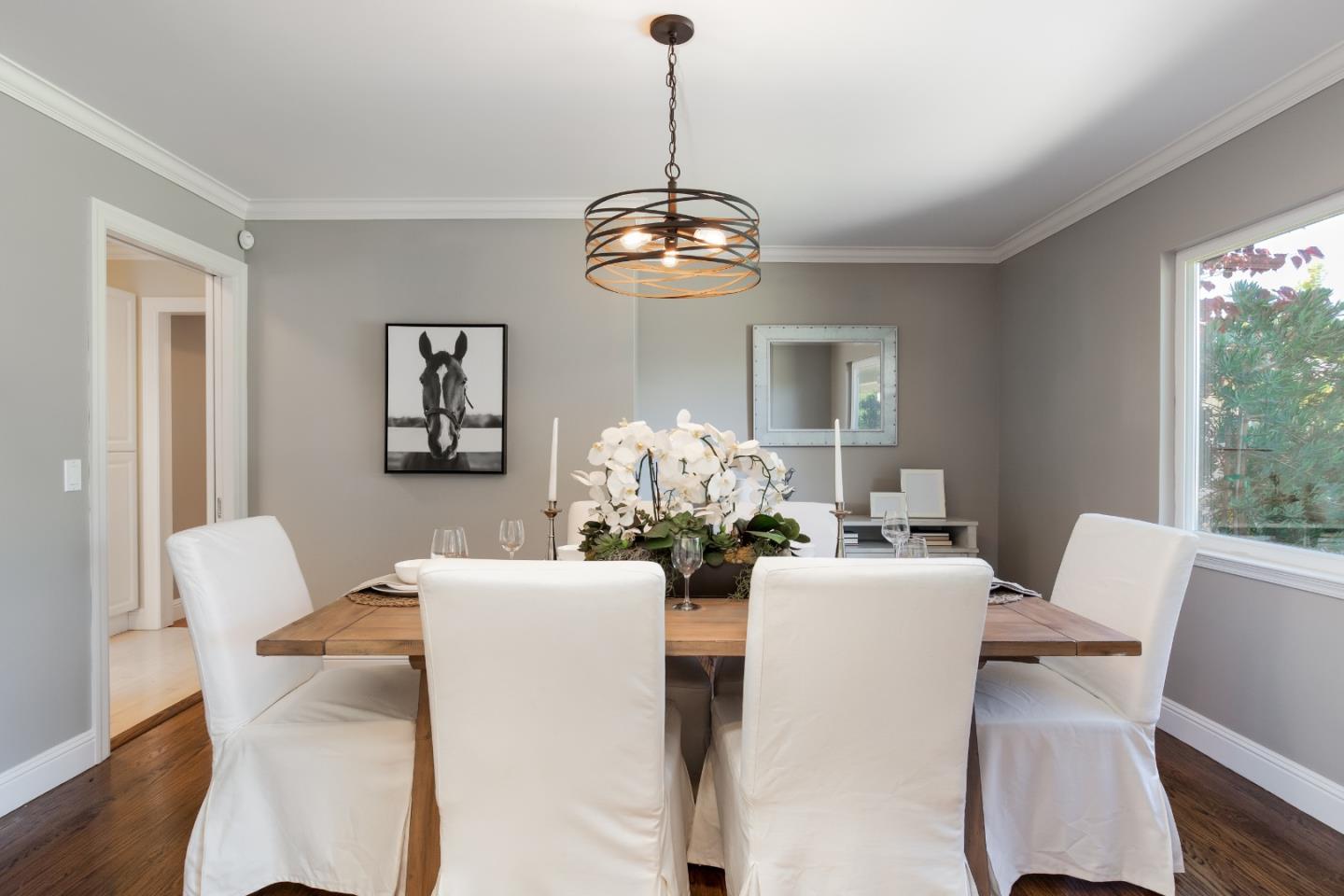 356 Barbara Way Hillsborough, CA 94010 - Photo 9 of 37 a dining room with furniture a chandelier and wooden floor