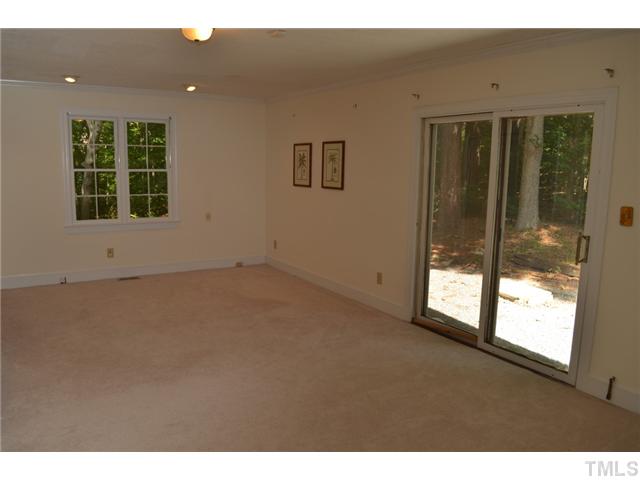 5004 Springwood Drive Raleigh, NC 27613 - Photo 15 of 22 a view of an empty room with a window