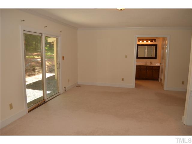 5004 Springwood Drive Raleigh, NC 27613 - Photo 16 of 22 a view of an empty room with a window