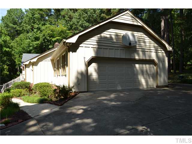 5004 Springwood Drive Raleigh, NC 27613 - Photo 2 of 22 a front view of a house with a garage
