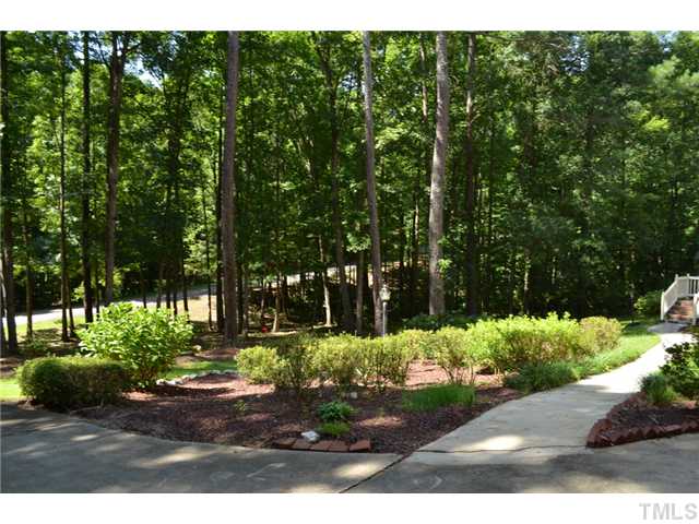 5004 Springwood Drive Raleigh, NC 27613 - Photo 3 of 22 a view of a park with large trees