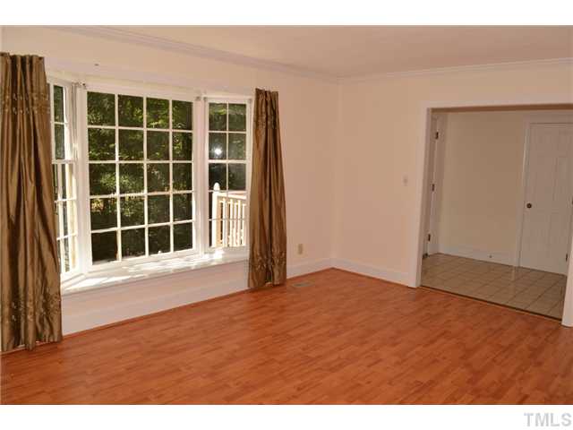 5004 Springwood Drive Raleigh, NC 27613 - Photo 5 of 22 a view of an empty room with a window