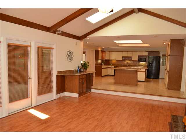 5004 Springwood Drive Raleigh, NC 27613 - Photo 8 of 22 a view of a living room and kitchen