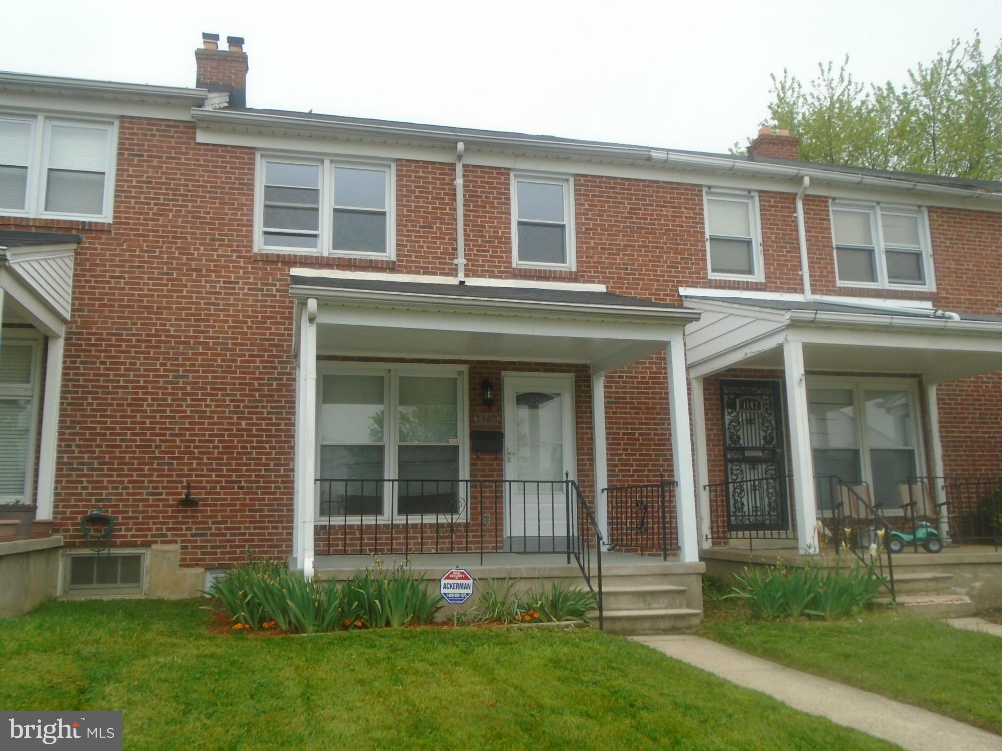 1140 Cedarcroft Road Baltimore, MD 21239 - Photo 3 of 23 front view of a house with a yard