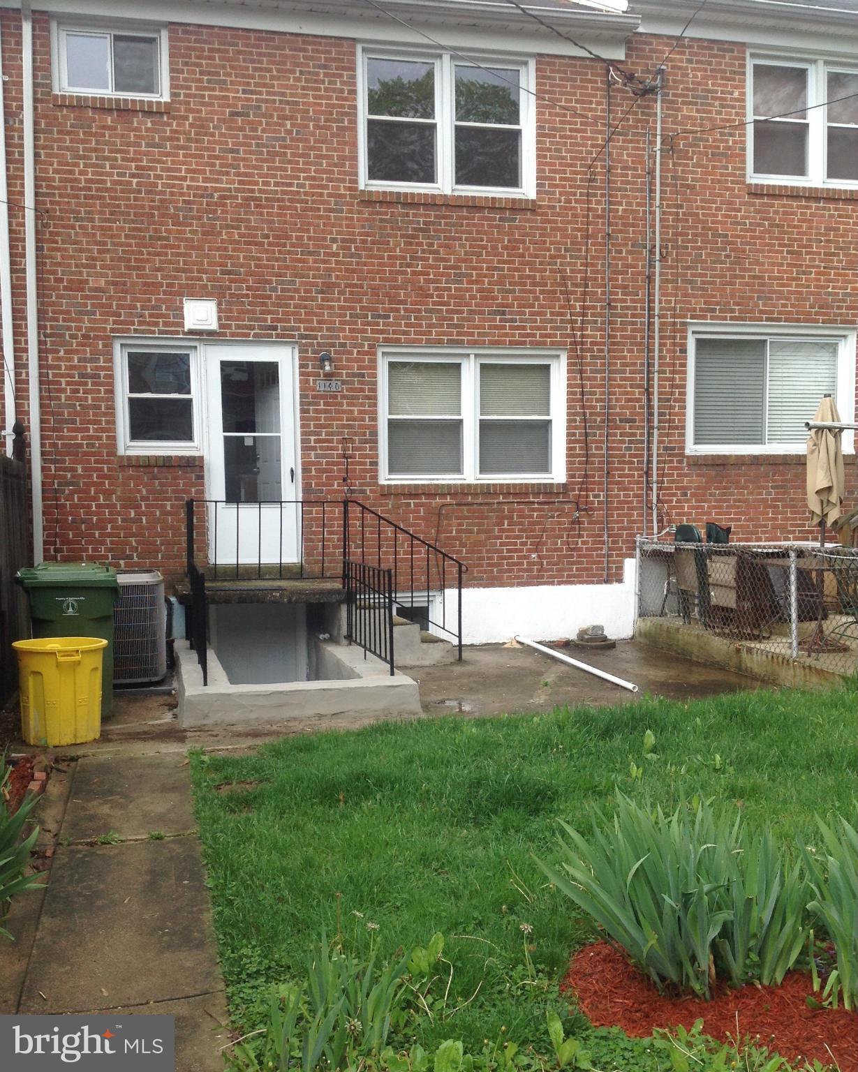 1140 Cedarcroft Road Baltimore, MD 21239 - Photo 21 of 23 a house view with a garden space