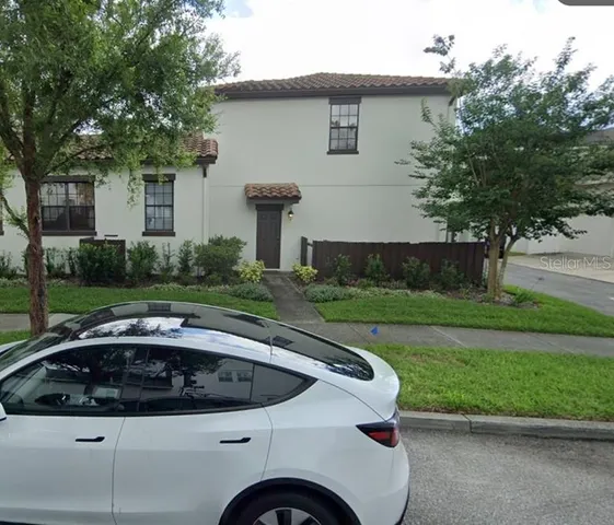 a view of a house with a sink and yard