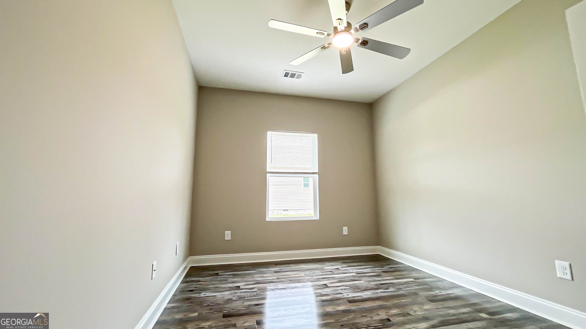 2011 Griffin Road Macon, GA 31216 - Photo 45 of 64 an empty room with windows and fan