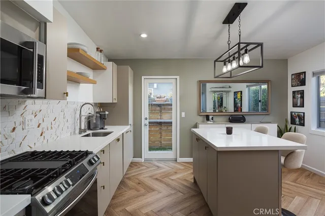 a kitchen with a stove and a sink