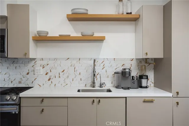 a kitchen with a sink and cabinets
