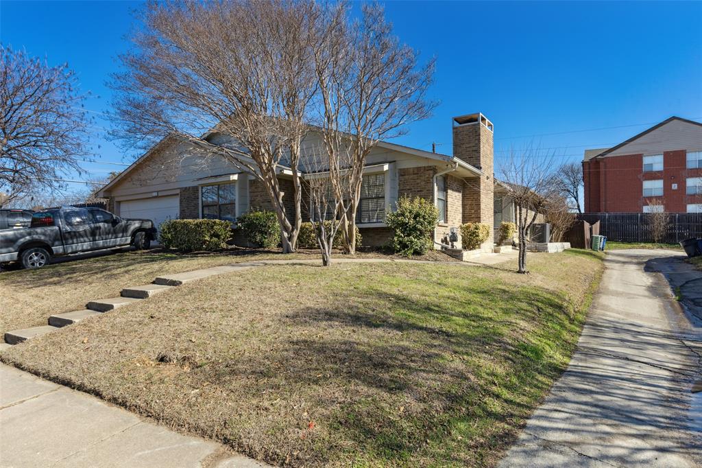19016 Tupelo Lane Dallas, TX 75007 - Photo 1 of 28 a front view of a house with a yard