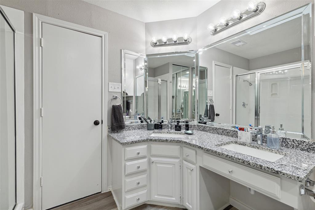19016 Tupelo Lane Dallas, TX 75007 - Photo 17 of 28 a bathroom with a granite countertop sink double and mirror
