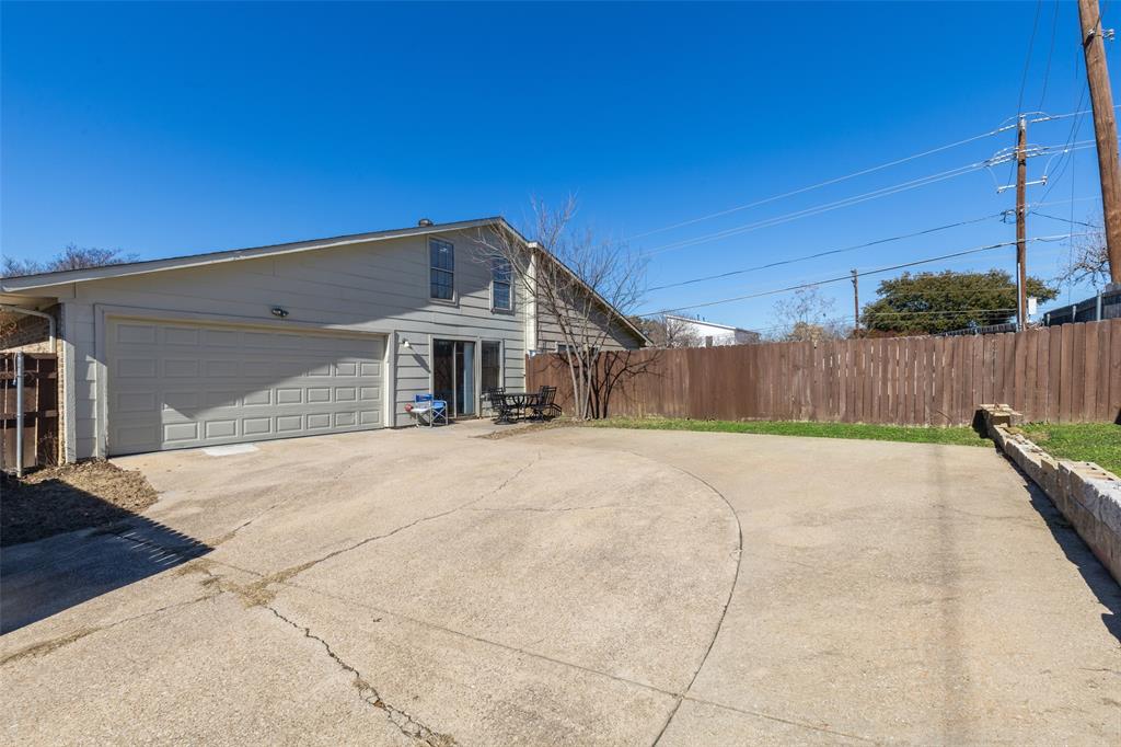 19016 Tupelo Lane Dallas, TX 75007 - Photo 24 of 28 a view of a house with a backyard
