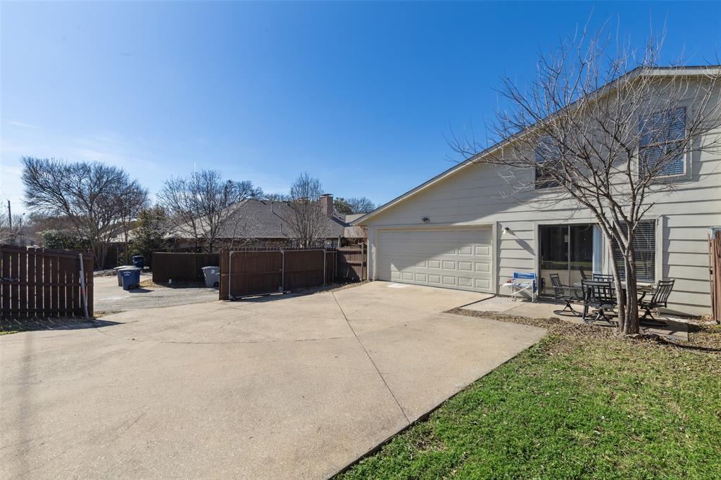 19016 Tupelo Lane Dallas, TX 75007 - Photo 26 of 28 a house with yard in front of it