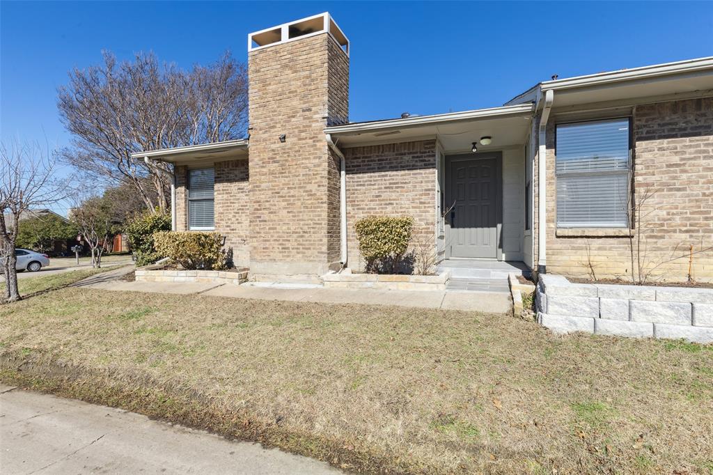 19016 Tupelo Lane Dallas, TX 75007 - Photo 27 of 28 a front view of a house with a yard