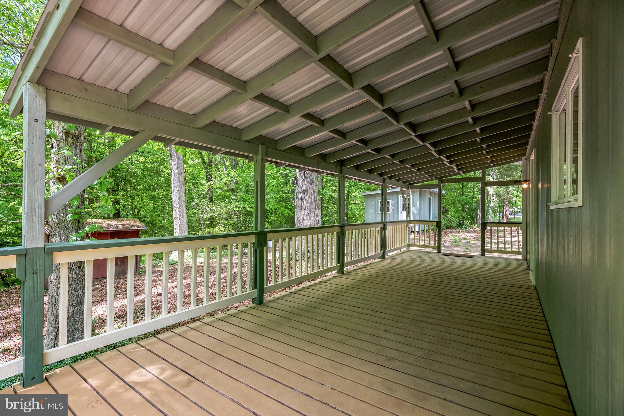 11425 Mill Bridge Road Lusby, MD 20657 - Photo 14 of 40 a view of balcony with wooden floor