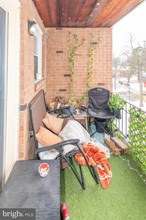 a view of a chairs and table in backyard
