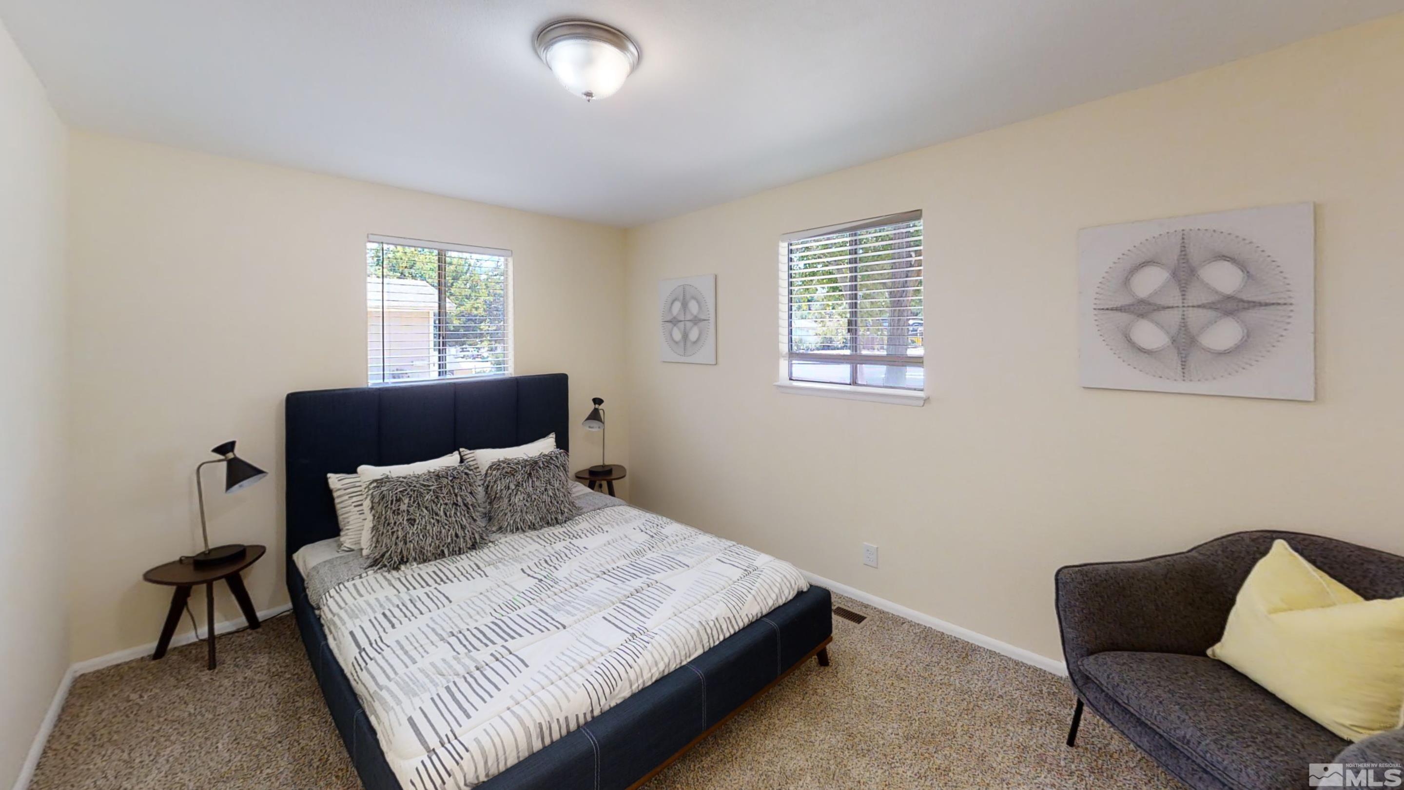 1690 Keystone Avenue Reno, NV 89503 - Photo 4 of 18 a bedroom with a bed and a couch