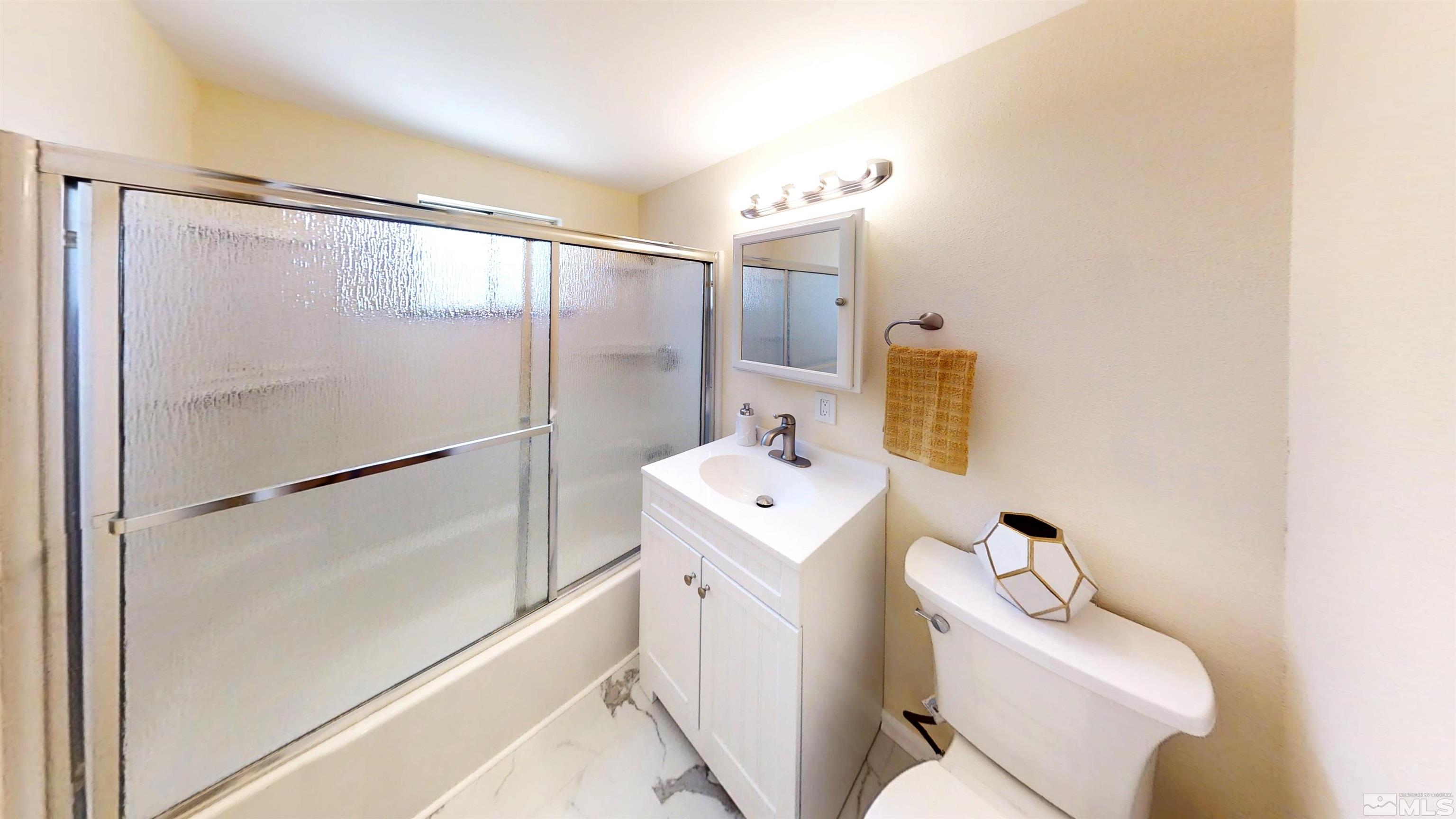 1690 Keystone Avenue Reno, NV 89503 - Photo 5 of 18 a bathroom with a sink toilet and shower
