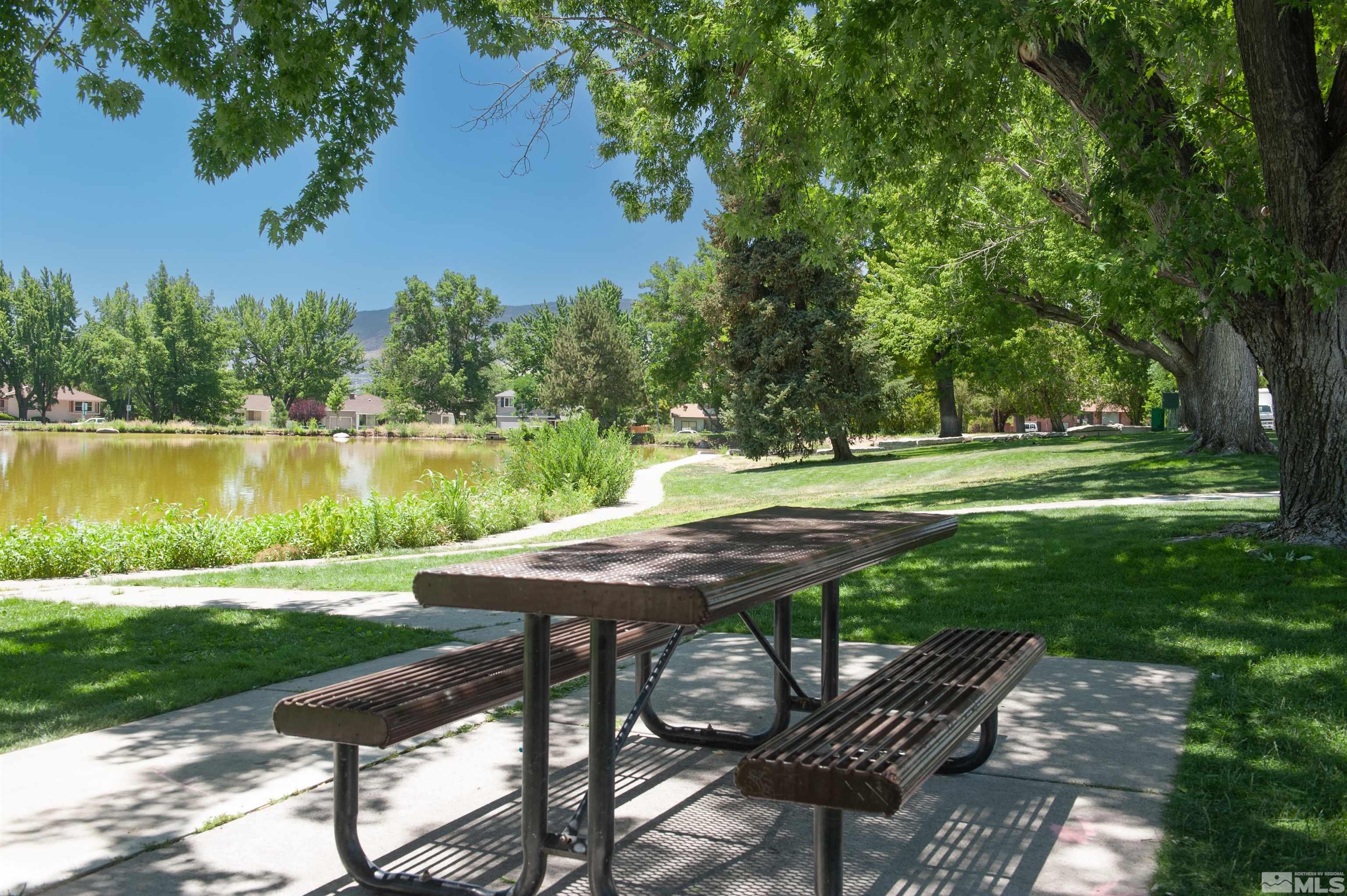 1690 Keystone Avenue Reno, NV 89503 - Photo 8 of 18 a view of a wooden dinning table and chairs in the garden
