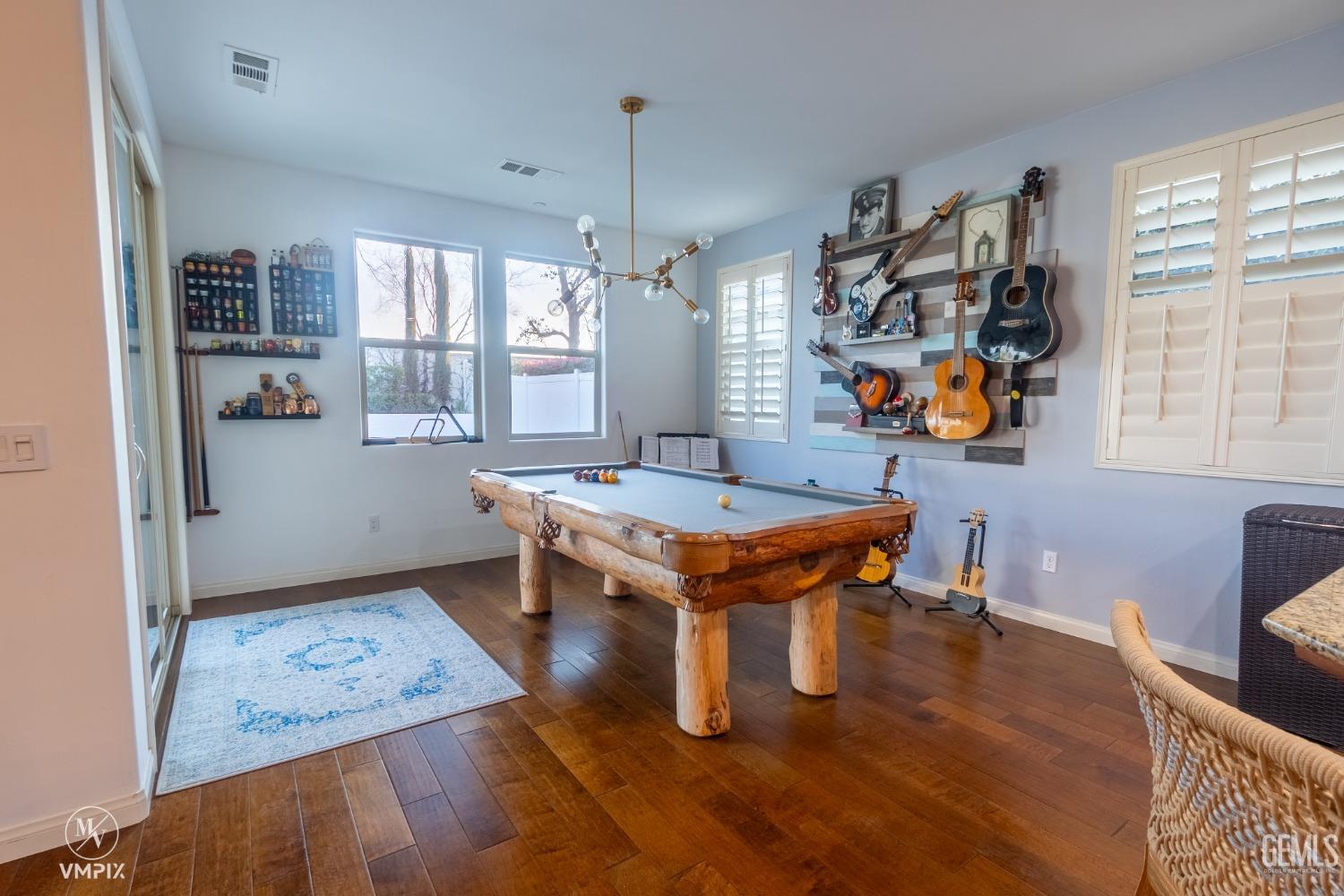 Undisclosed Address Bakersfield, CA 93311 - Photo 12 of 55 a living room with furniture and a table