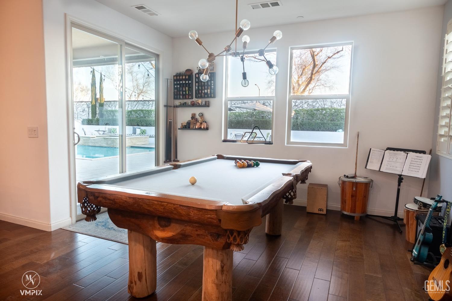 Undisclosed Address Bakersfield, CA 93311 - Photo 13 of 55 a view of a dining room with furniture window and wooden floor