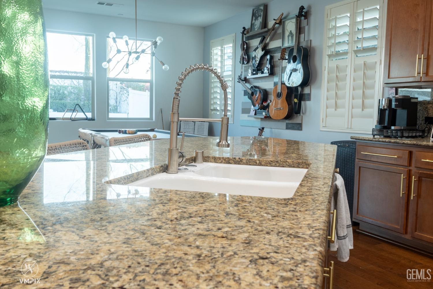 Undisclosed Address Bakersfield, CA 93311 - Photo 19 of 55 a bathroom with a granite countertop sink a mirror and window