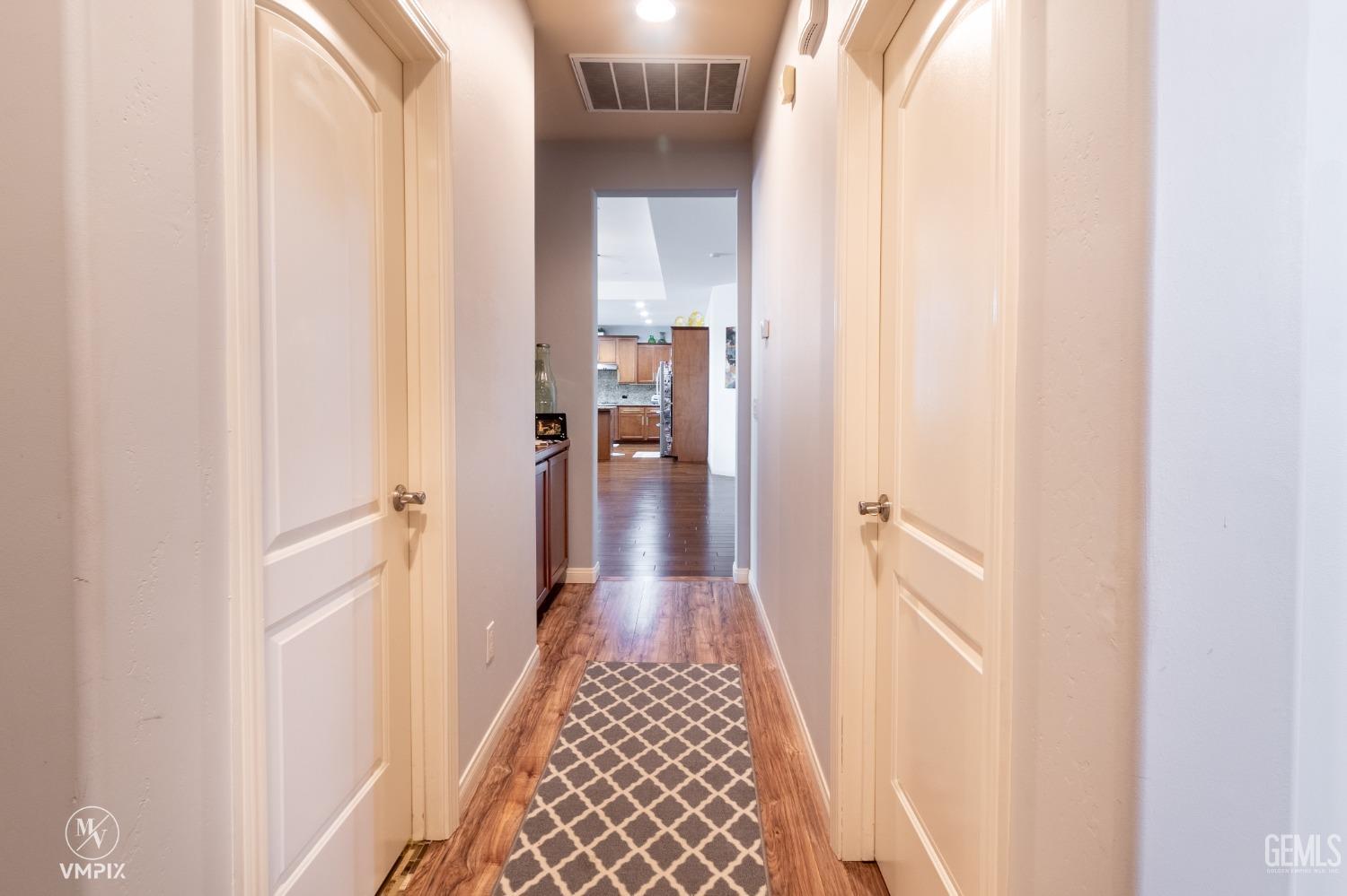 Undisclosed Address Bakersfield, CA 93311 - Photo 22 of 55 a view of hallway with wooden floor