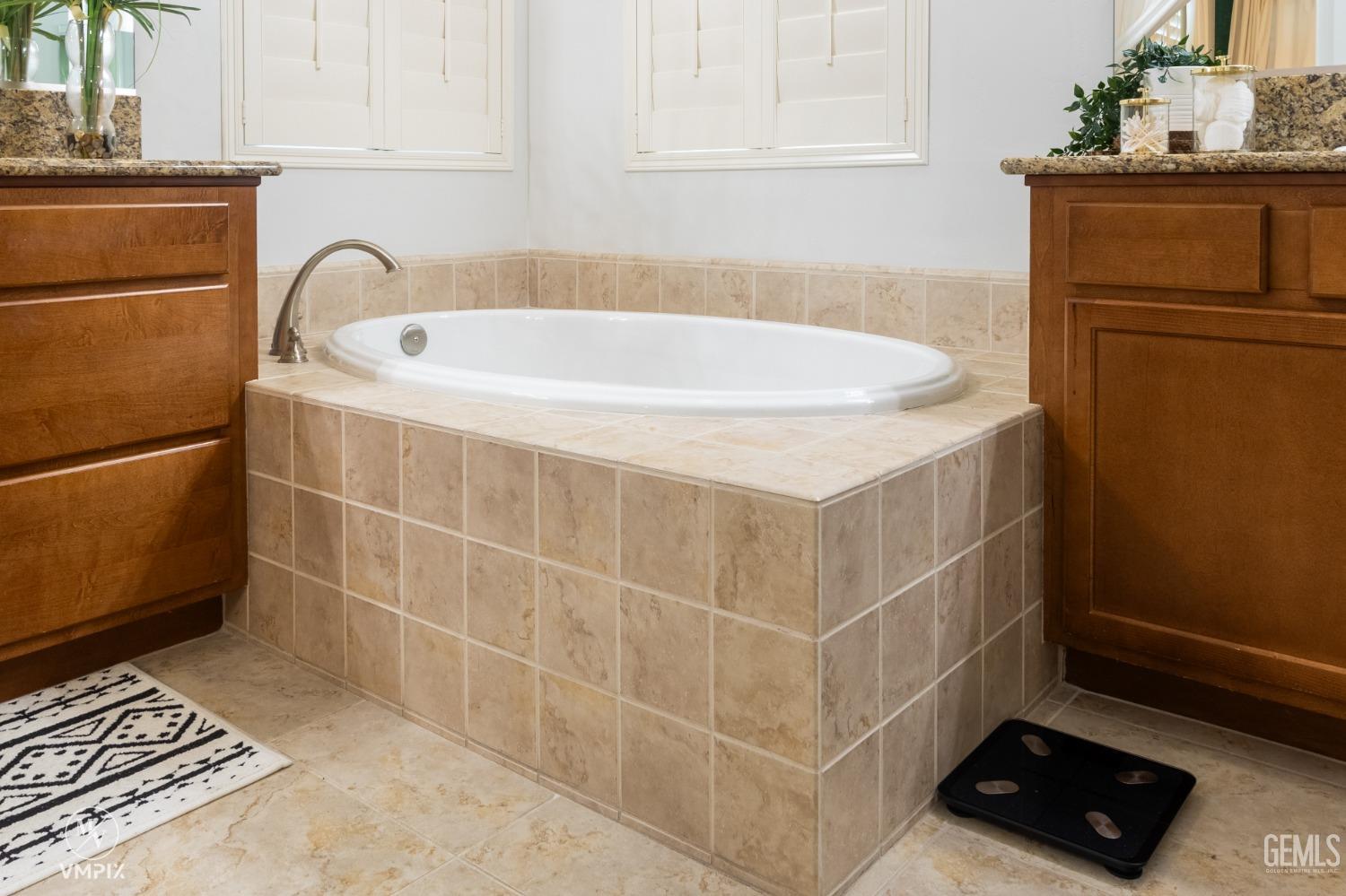 Undisclosed Address Bakersfield, CA 93311 - Photo 36 of 55 a bathroom with a bathtub