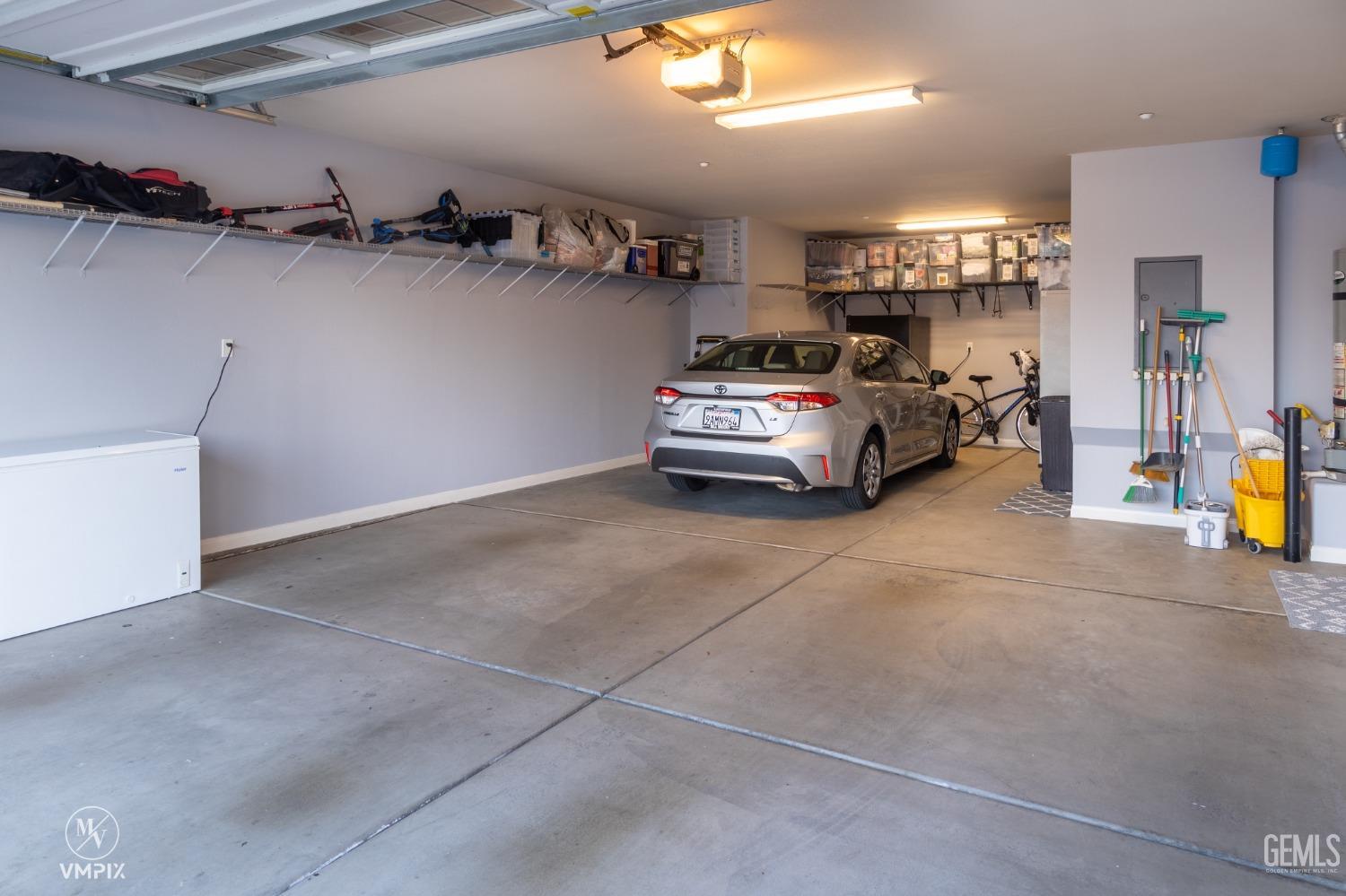 Undisclosed Address Bakersfield, CA 93311 - Photo 40 of 55 a car parked in a garage