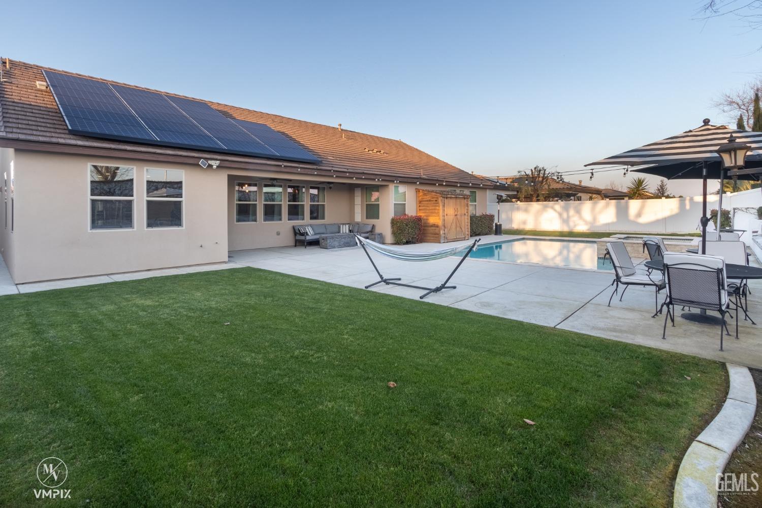 Undisclosed Address Bakersfield, CA 93311 - Photo 41 of 55 a view of a house with a yard and sitting area