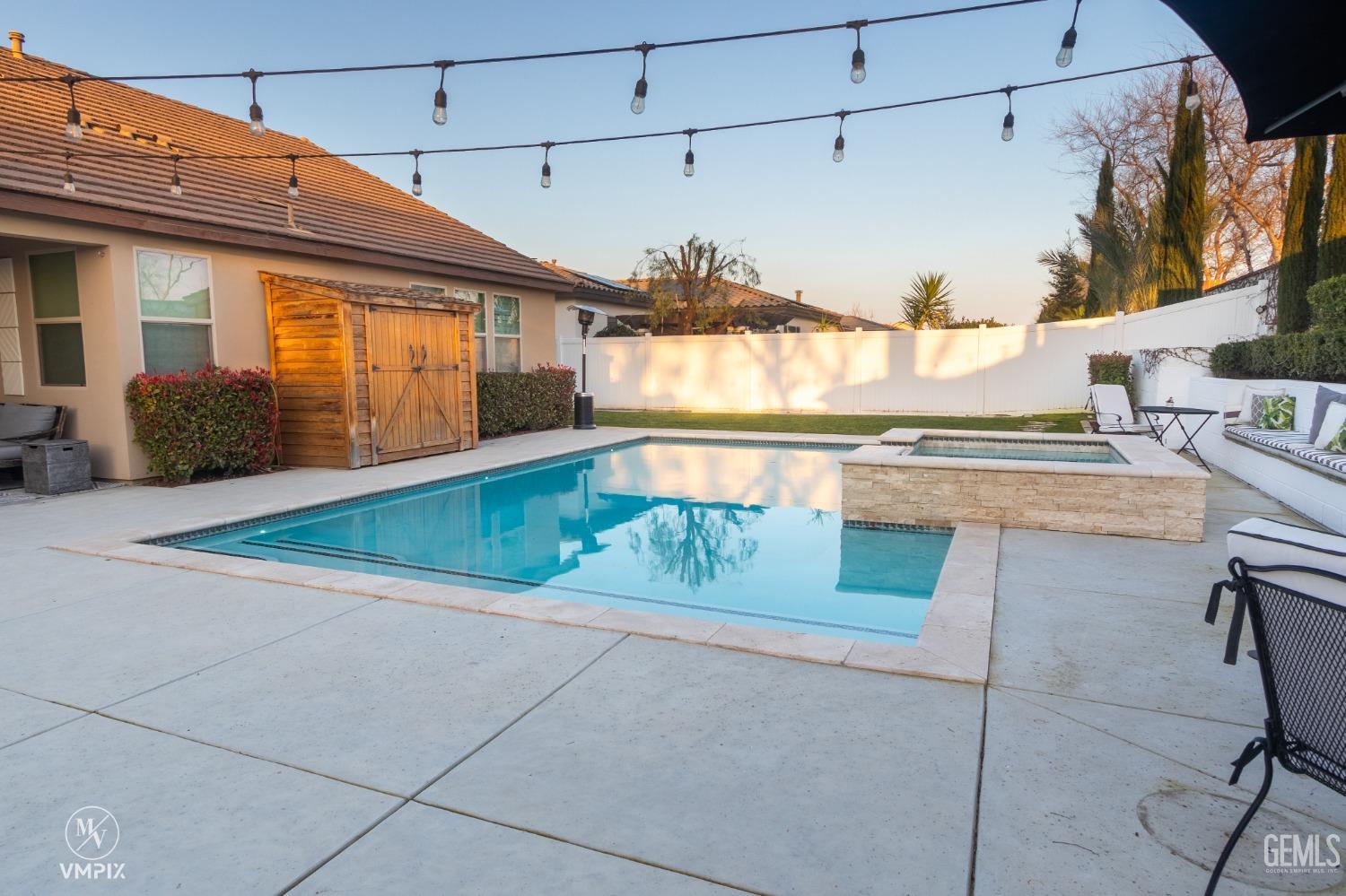 Undisclosed Address Bakersfield, CA 93311 - Photo 44 of 55 a view of a house with a swimming pool
