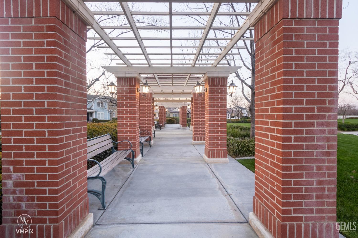 Undisclosed Address Bakersfield, CA 93311 - Photo 46 of 55 a view of a brick building with many windows