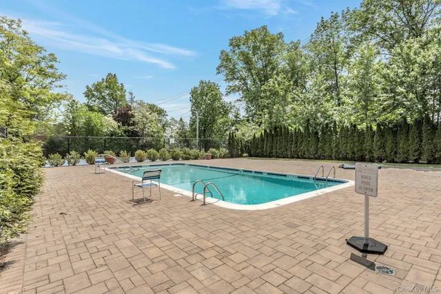 a view of a swimming pool and a yard
