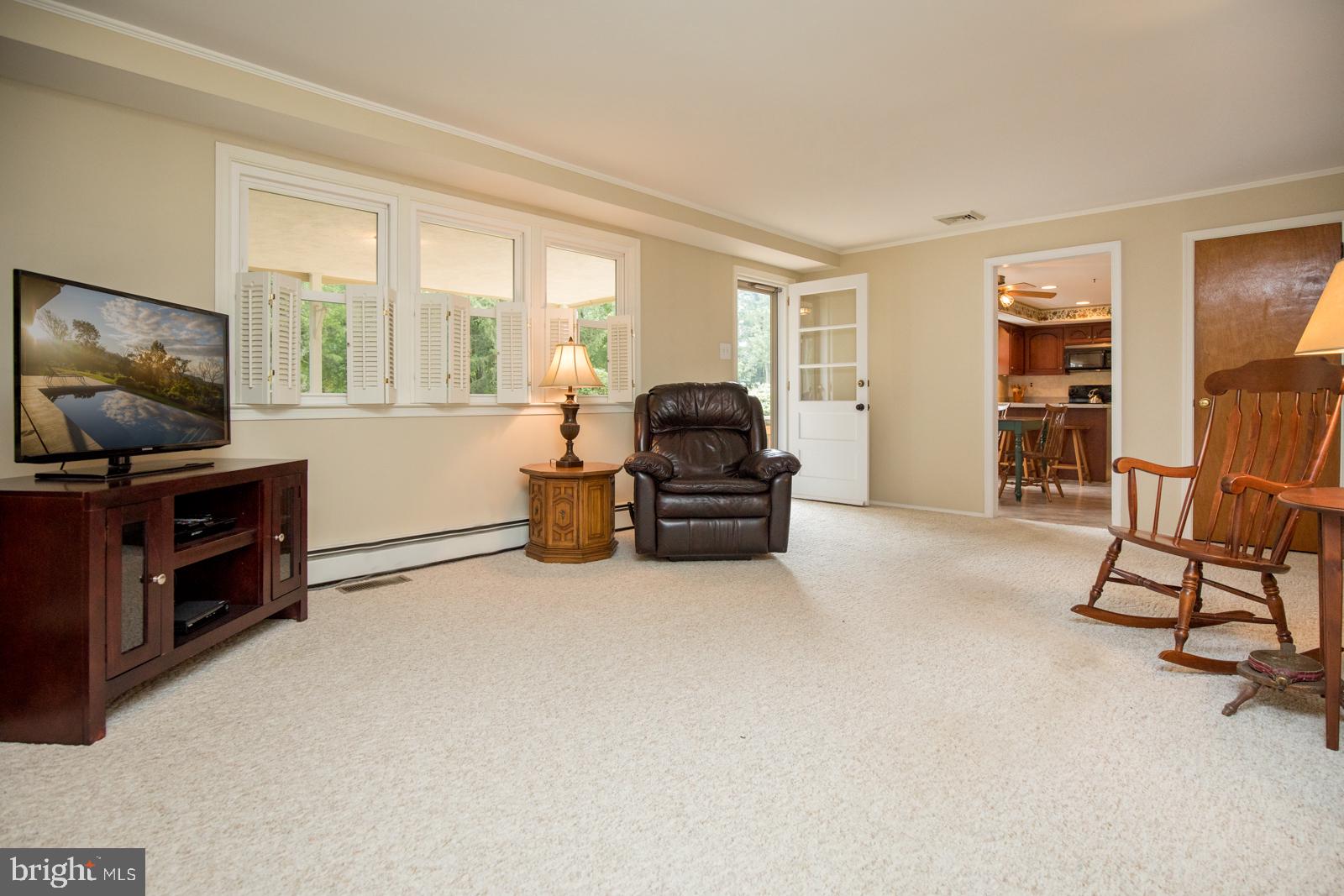 218 Pebble Ridge Road Warrington, PA 18976 - Photo 11 of 41 Family Room with door to Deck & open to Kitchen