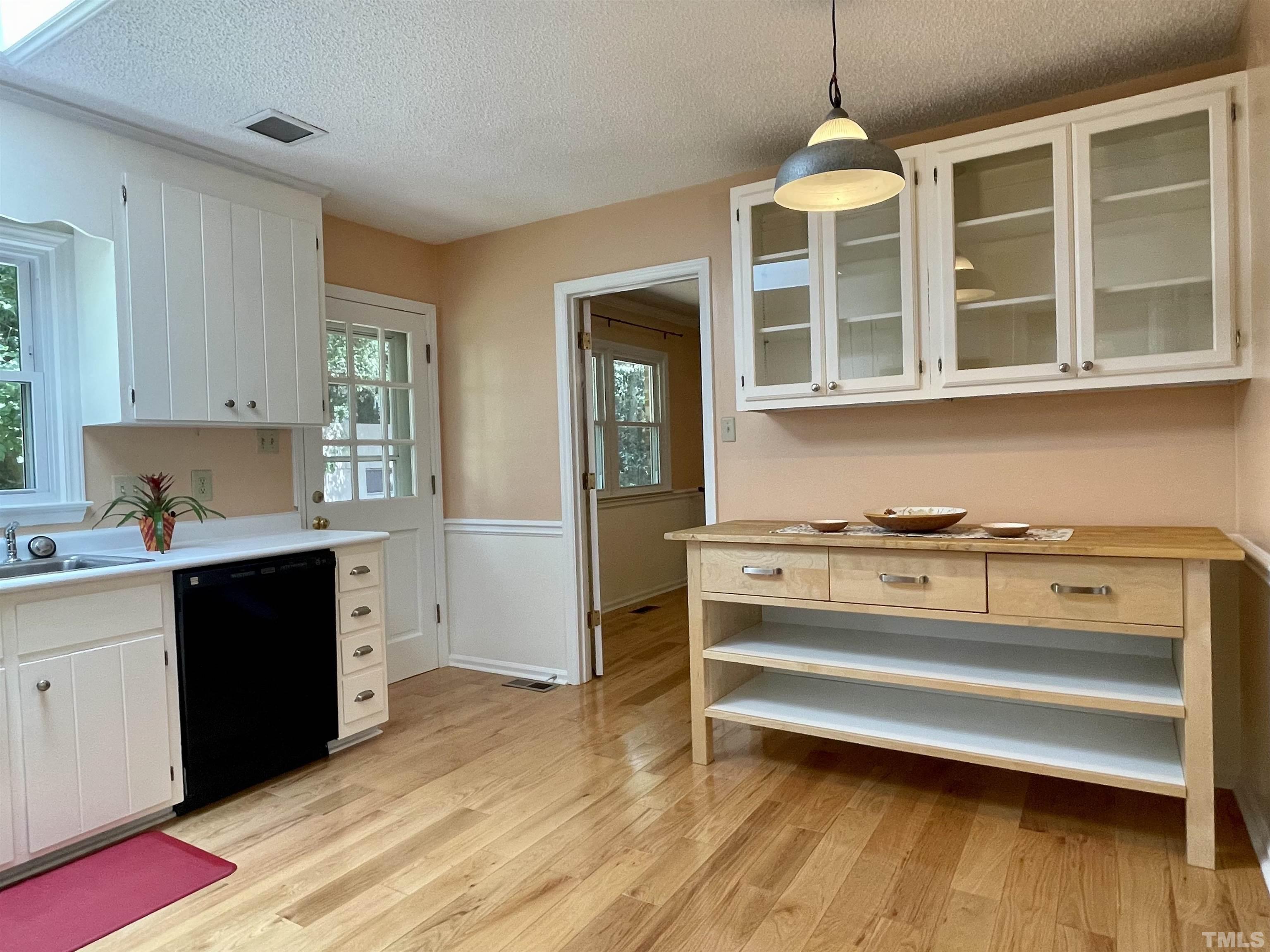 4506 Malvern Road Durham, NC 27707 - Photo 23 of 40 IKEA butcher block table provides extra work space and extra storage space.