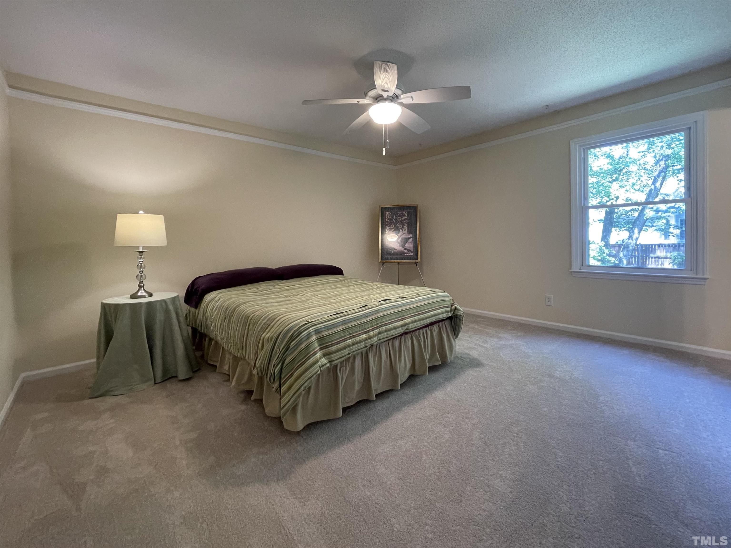 4506 Malvern Road Durham, NC 27707 - Photo 24 of 40 Roomy primary bedroom. Ceiling fan to keep you cool at night.
