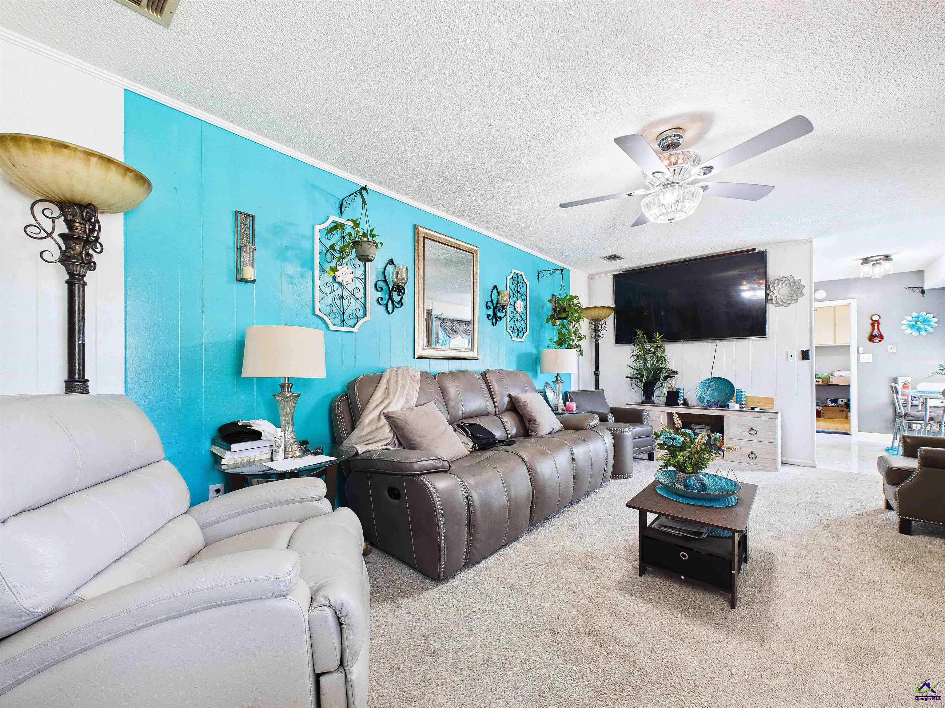 400 Feagin Mill Road Warner Robins, GA 31005 - Photo 23 of 53 a living room with furniture and a flat screen tv